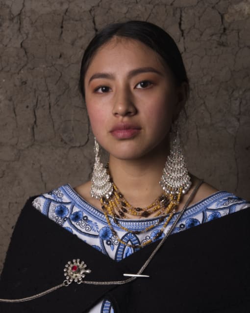 A young woman dressed in traditional clothing from Saraguro, Ecuador